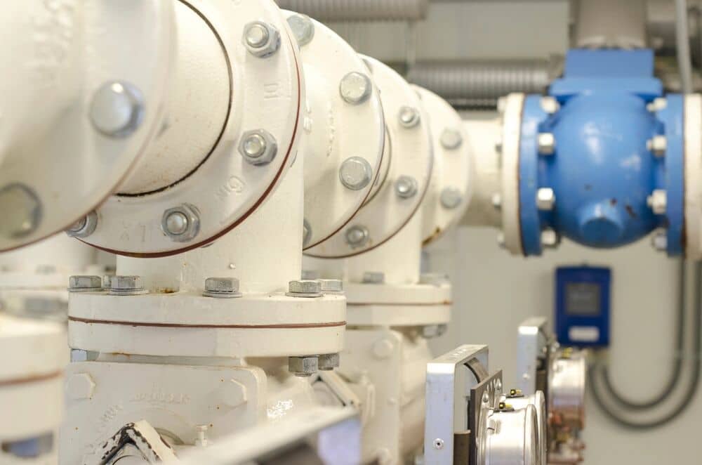 Engineer reviewing instrumentation and control equipment